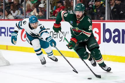 Mar 28, 2024; Saint Paul, Minnesota, USA; Minnesota Wild center Marcus Johansson (90) skates with the puck as San Jose Sharks defenseman Jan Rutta (84) defends during the second period at Xcel Energy Center. Mandatory Credit: Matt Krohn-USA TODAY Sports