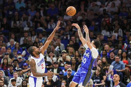 Mar 29, 2024; Orlando, Florida, USA; Orlando Magic guard Cole Anthony (50) shoots the ball over LA Clippers forward Kawhi Leonard (2) during the second half at KIA Center. Mandatory Credit: Mike Watters-USA TODAY Sports