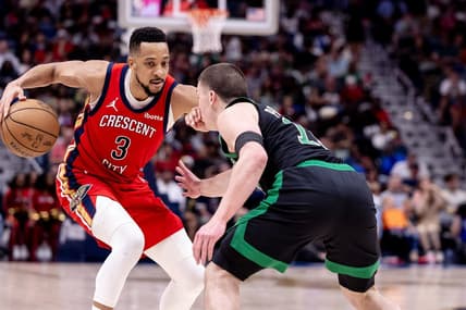 Mar 30, 2024; New Orleans, Louisiana, USA; New Orleans Pelicans guard CJ McCollum (3) dribbles against Boston Celtics guard Payton Pritchard (11) during the second half at Smoothie King Center. Mandatory Credit: Stephen Lew-USA TODAY Sports