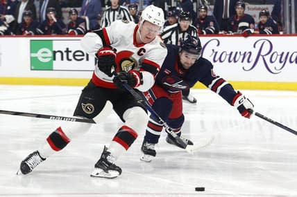 Mar 30, 2024; Winnipeg, Manitoba, CAN; Ottawa Senators left wing Brady Tkachuk (7) is chased down by Winnipeg Jets defenseman Neal Pionk (4) in the first period at Canada Life Centre. Mandatory Credit: James Carey Lauder-USA TODAY Sports