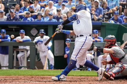 Mar 31, 2024; Kansas City, Missouri, USA; Kansas City Royals first baseman Salvador Perez (13) hits a one RBI single against the Minnesota Twins in the second inning at Kauffman Stadium. Mandatory Credit: Denny Medley-USA TODAY Sports