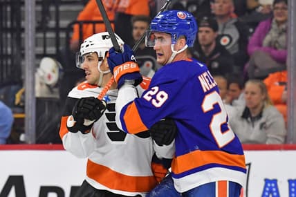 Apr 1, 2024; Philadelphia, Pennsylvania, USA; Philadelphia Flyers center Morgan Frost (48) and New York Islanders center Brock Nelson (29) battle for position during the second period at Wells Fargo Center. Mandatory Credit: Eric Hartline-USA TODAY Sports