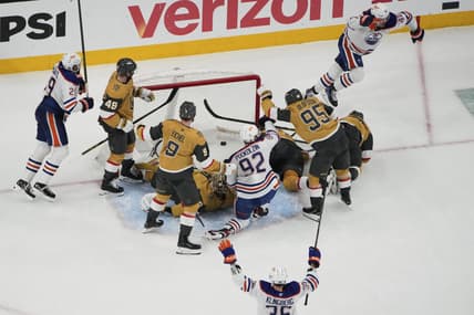 Edmonton Oilers right wing Kasperi Kapanen, upper right, celebrates after scoring against the Vegas Golden Knights during overtime of Game 5 of a second-round NHL hockey playoff series Wednesday, May 14, 2025, in Las Vegas. (AP Photo/John Locher)