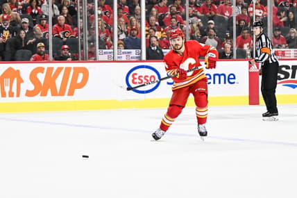 CALGARY, AB - OCTOBER 18: Calgary Flames Defenceman Rasmus Andersson (4) passes the puck during the second period of an NHL game between the Calgary Flames and the Vegas Golden Knights on October 18, 2022, at the Scotiabank Saddledome in Calgary, AB. (Photo by Brett Holmes/Icon Sportswire)