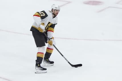 Vegas Golden Knights Defenseman Shea Theodore (27) controls the puck during the first period of the National Hockey League game between the Vegas Golden Knights and the New York Islanders on February 4, 2025, at UBS Arena in Elmont, NY.