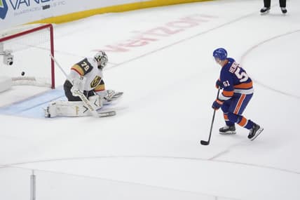 ELMONT, NY - DECEMBER 09: New York Islanders Left Wing Emil Heineman (51) scores the winning goal against Vegas Golden Knights Goalie Carter Hart (79) during the shootout of the National Hockey League game between the Vegas Golden Knights and the New York Islanders on December 9, 2025, at UBS Arena in Elmont, NY. (Photo by Gregory Fisher/Icon Sportswire)