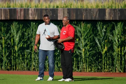 Hall of Fame baseball player and former Cincinnati Reds center fielder Ken Griffey Jr., left, asks his dad and fellow  Hall of