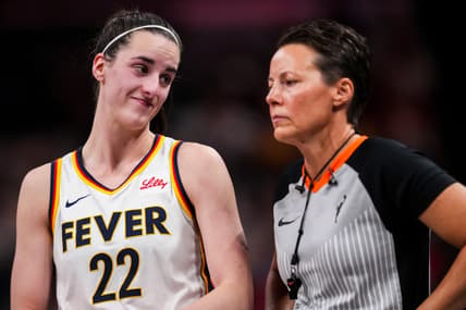 Indiana Fever guard Caitlin Clark (22) smiles at an official Wednesday, Aug. 28, 2024, during a game between the Indiana Fever