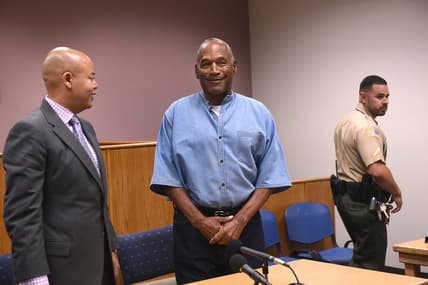 O.J. Simpson reacts after learning he will be granted parole during a hearing at Lovelock Correctional Center on July 20, 2017.