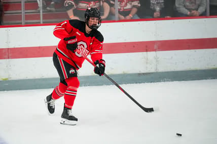 Ohio State Buckeyes defenseman Emma Peschel (7) passes the puck in the first period during the first round of the WCHA at OSU