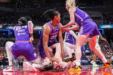 Phoenix Mercury forward Alyssa Thomas (25) scrambles to get up over Indiana Fever guard Caitlin Clark (22) on Wednesday, June