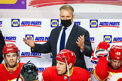 Jan 26, 2021; Calgary, Alberta, CAN; Calgary Flames head coach Geoff Ward reacts on his bench during the first period against the Toronto Maple Leafs at Scotiabank Saddledome. Mandatory Credit: Sergei Belski-USA TODAY Sports