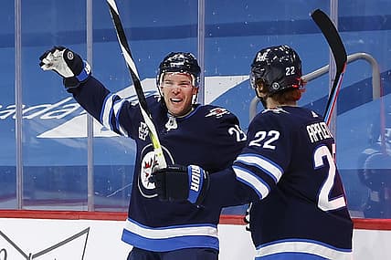 Feb 11, 2021; Winnipeg, Manitoba, CAN; Winnipeg Jets center Paul Stastny (25) celebrates his second period goal with center Mason Appleton (22) against the Ottawa Senators at Bell MTS Place. Mandatory Credit: James Carey Lauder-USA TODAY Sports