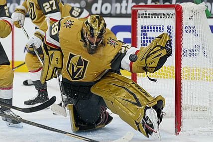 Mar 3, 2021; Las Vegas, Nevada, USA; Vegas Golden Knights goaltender Marc-Andre Fleury (29) blocks a shot by the Minnesota Wild during the first period of an NHL hockey game Wednesday, March 3, 2021, in Las Vegas.   Mandatory Credit:  John Locher-POOL PHOTOS-USA TODAY Sports