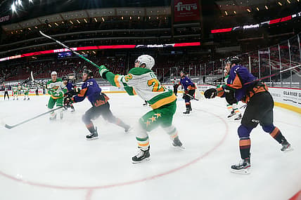 Mar 6, 2021; Glendale, Arizona, USA; Minnesota Wild left wing Kevin Fiala (22) bats down a puck against the Arizona Coyotes during the second period at Gila River Arena. Mandatory Credit: Joe Camporeale-USA TODAY Sports