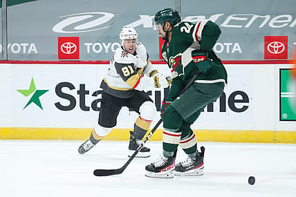 Mar 8, 2021; Saint Paul, Minnesota, USA; Vegas Golden Knights center Jonathan Marchessault (81) shoots the puck while Minnesota Wild defenseman Matt Dumba (24) defends in the first period at Xcel Energy Center. Mandatory Credit: David Berding-USA TODAY Sports
