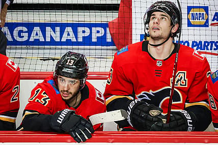 Mar 17, 2021; Calgary, Alberta, CAN; Calgary Flames left wing Johnny Gaudreau (13) and center Sean Monahan (23) on their bench against the Edmonton Oilers during the third period at Scotiabank Saddledome. Mandatory Credit: Sergei Belski-USA TODAY Sports