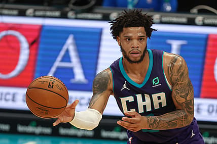 Apr 27, 2021; Charlotte, North Carolina, USA; Charlotte Hornets forward Miles Bridges (0) passes against the Milwaukee Bucks in the first half at Spectrum Center. The Milwaukee Bucks won 114-104. Mandatory Credit: Nell Redmond-USA TODAY Sports