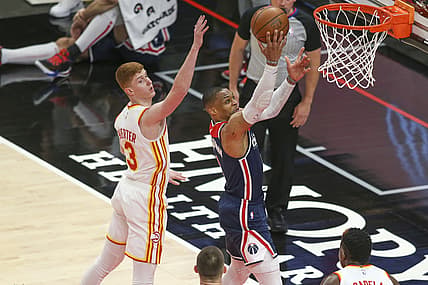 May 10, 2021; Atlanta, Georgia, USA; Washington Wizards guard Russell Westbrook (4) shoots past Atlanta Hawks guard Kevin Huerter (3) in the first quarter at State Farm Arena. Mandatory Credit: Brett Davis-USA TODAY Sports
