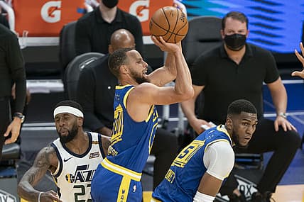 May 10, 2021; San Francisco, California, USA; Golden State Warriors guard Stephen Curry (30) shoots the basketball behind center Kevon Looney (5) against Utah Jazz forward Royce O'Neale (23) during the second quarter at Chase Center. Mandatory Credit: Kyle Terada-USA TODAY Sports