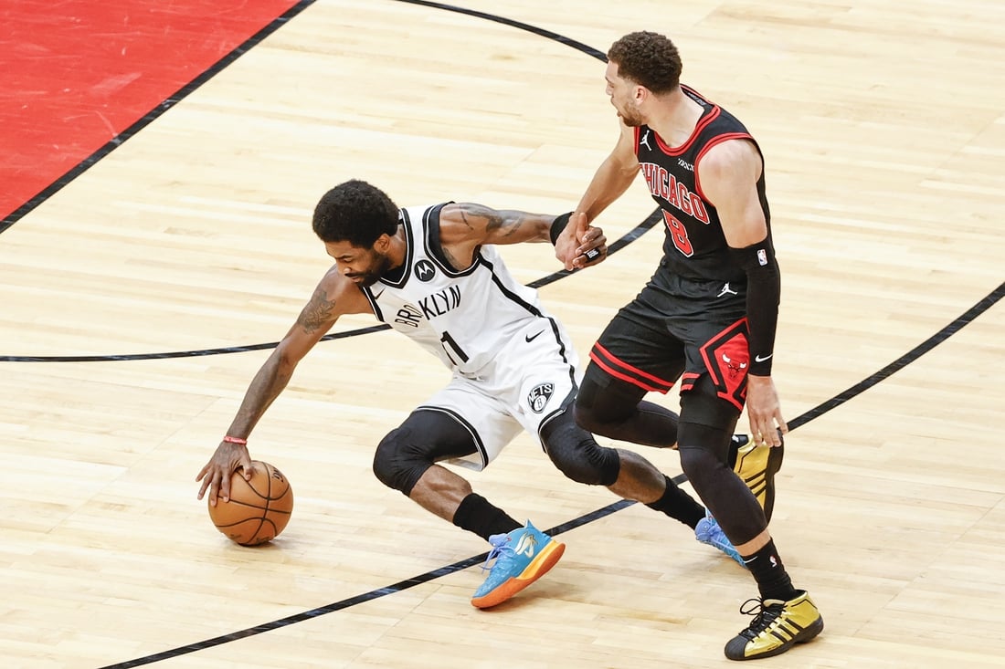 May 11, 2021; Chicago, Illinois, USA; Chicago Bulls guard Zach LaVine (8) fouls Brooklyn Nets guard Kyrie Irving (11) during the first half at United Center. Mandatory Credit: Kamil Krzaczynski-USA TODAY Sports