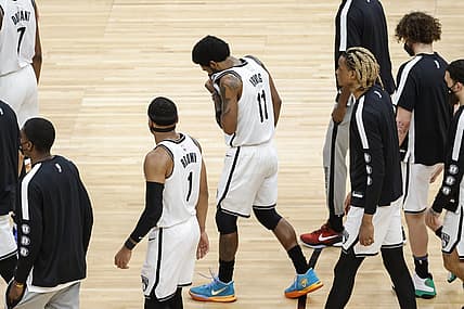 Brooklyn Nets guard Kyrie Irving (11) leaves the game against the Chicago Bulls during the second half at United Center. Mandatory Credit: Kamil Krzaczynski-USA TODAY Sports