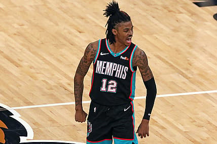May 11, 2021; Memphis, Tennessee, USA; Memphis Grizzlies guard Ja Morant (12) celebrates after a basket during the third quarter against the Dallas Mavericks at FedExForum. Mandatory Credit: Petre Thomas-USA TODAY Sports