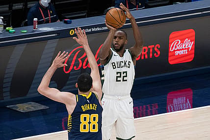 May 13, 2021; Indianapolis, Indiana, USA; Milwaukee Bucks forward Khris Middleton (22) shoots the ball while Indiana Pacers center Goga Bitadze (88) defends in the second quarter at Bankers Life Fieldhouse. Mandatory Credit: Trevor Ruszkowski-USA TODAY Sports