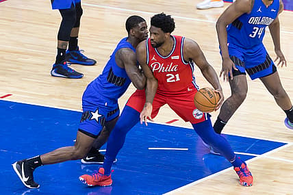 May 14, 2021; Philadelphia, Pennsylvania, USA; Philadelphia 76ers center Joel Embiid (21) drives against Orlando Magic guard Dwayne Bacon (8) during the third quarter at Wells Fargo Center. Mandatory Credit: Bill Streicher-USA TODAY Sports