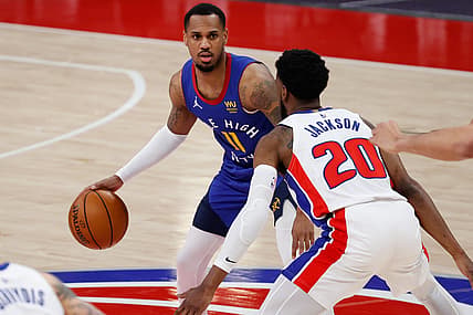 May 14, 2021; Detroit, Michigan, USA; Denver Nuggets guard Monte Morris (11) dribbles on Detroit Pistons guard Josh Jackson (20) in the second half at Little Caesars Arena. Mandatory Credit: Rick Osentoski-USA TODAY Sports