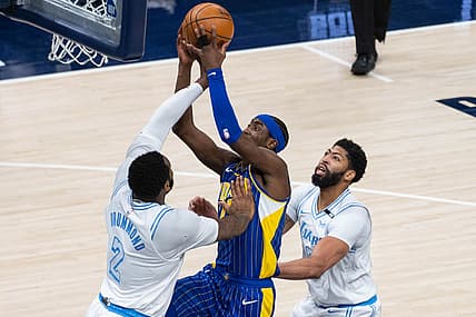 May 15, 2021; Indianapolis, Indiana, USA; Indiana Pacers guard Caris LeVert (22) shoots the ball while Los Angeles Lakers center Andre Drummond (2) defends in the second  quarter at Bankers Life Fieldhouse. Mandatory Credit: Trevor Ruszkowski-USA TODAY Sports