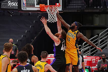 May 16, 2021; Tampa, Florida, USA; Indiana Pacers forward JaKarr Sampson (14) fouls Toronto Raptors center Aron Baynes (46) during the first half at Amalie Arena. Mandatory Credit: Jasen Vinlove-USA TODAY Sports