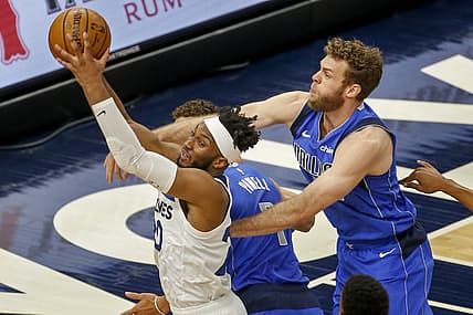 May 16, 2021; Minneapolis, Minnesota, USA; Minnesota Timberwolves forward Josh Okogie (20) grabs a rebound as Dallas Mavericks forward Nicolo Melli (44) defends in the first quarter at Target Center. Mandatory Credit: Bruce Kluckhohn-USA TODAY Sports