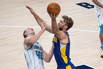 May 18, 2021; Indianapolis, Indiana, USA; Indiana Pacers forward Domantas Sabonis (11) shoots the ball while Charlotte Hornets center Cody Zeller (40) defends  in the second quarter at Bankers Life Fieldhouse. Mandatory Credit: Trevor Ruszkowski-USA TODAY Sports