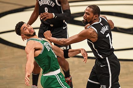 May 22, 2021; Brooklyn, New York, USA;  Brooklyn Nets forward Kevin Durant (7) and Boston Celtics forward Jayson Tatum (0) battle on the court during the fourth quarter of game one in the first round of the 2021 NBA Playoffs. at Barclays Center. Mandatory Credit: Dennis Schneidler-USA TODAY Sports