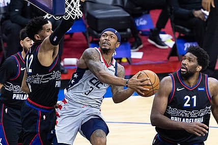 May 23, 2021; Philadelphia, Pennsylvania, USA; Washington Wizards guard Bradley Beal (3) drives for a score against Philadelphia 76ers forward Tobias Harris (12) and center Joel Embiid (21) during the third quarter of game one in the first round of the 2021 NBA Playoffs at Wells Fargo Center. Mandatory Credit: Bill Streicher-USA TODAY Sports