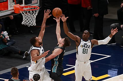 May 23, 2021; Salt Lake City, Utah, USA;  Memphis Grizzlies guard Grayson Allen (3) shoots the ball between Utah Jazz center Rudy Gobert (27) and guard Miye Oni (81) during the fourth quarter at Vivint Arena. Memphis Grizzlies won 112-109. Mandatory Credit: Chris Nicoll-USA TODAY Sports