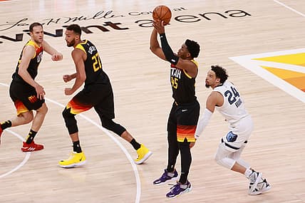 May 26, 2021; Salt Lake City, Utah, USA; Utah Jazz guard Donovan Mitchell (45) shoots a three point shot after getting past Memphis Grizzlies forward Dillon Brooks (24) during the second half in game two of the first round of the 2021 NBA Playoffs at Vivint Arena. Utah Jazz won 141-129. Mandatory Credit: Chris Nicoll-USA TODAY Sports