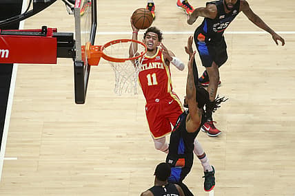 May 28, 2021; Atlanta, Georgia, USA; Atlanta Hawks guard Trae Young (11) shoots the ball over New York Knicks guard Derrick Rose (4) in the first quarter during game three in the first round of the 2021 NBA Playoffs at State Farm Arena. Mandatory Credit: Brett Davis-USA TODAY Sports