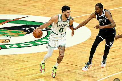 May 30, 2021; Boston, Massachusetts, USA; Boston Celtics forward Jayson Tatum (0) controls the ball in front of Brooklyn Nets forward Kevin Durant (7) during the first half of game four in the first round of the 2021 NBA Playoffs. at TD Garden. Mandatory Credit: Brian Fluharty-USA TODAY Sports