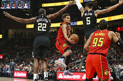 Dec 27, 2019; Atlanta, Georgia, USA; Atlanta Hawks guard Trae Young (11) passes the ball against the Milwaukee Bucks in the first half at State Farm Arena. Mandatory Credit: Brett Davis-USA TODAY Sports