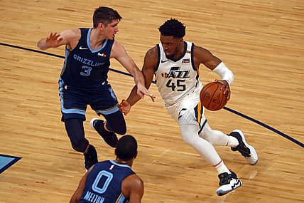May 31, 2021; Memphis, Tennessee, USA; Utah Jazz guard Donovan Mitchell (45) drives to the basket as Memphis Grizzlies guard Grayson Allen (3) defends during the fourth quarter during game four in the first round of the 2021 NBA Playoffs at FedExForum. Mandatory Credit: Petre Thomas-USA TODAY Sports