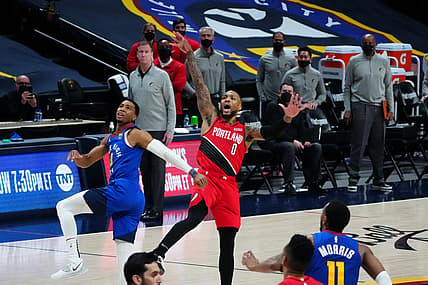 Jun 1, 2021; Denver, Colorado, USA; Portland Trail Blazers guard Damian Lillard (0) shoots and ties the game in overtime against the Denver Nuggets during game five in the first round of the 2021 NBA Playoffs. at Ball Arena. Mandatory Credit: Ron Chenoy-USA TODAY Sports