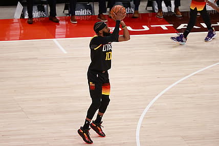 Jun 2, 2021; Salt Lake City, Utah, USA; Utah Jazz guard Mike Conley (10) shoots the ball during the first quarter against the Memphis Grizzlies in game five of the first round of the 2021 NBA Playoffs at Vivint Arena. Mandatory Credit: Chris Nicoll-USA TODAY Sports