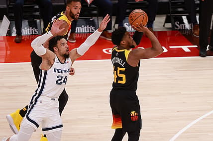 Jun 2, 2021; Salt Lake City, Utah, USA; Utah Jazz guard Donovan Mitchell (45) gets away from Memphis Grizzlies forward Dillon Brooks (24) and shoots the ball during the first quarter in game five of the first round of the 2021 NBA Playoffs at Vivint Arena. Mandatory Credit: Chris Nicoll-USA TODAY Sports