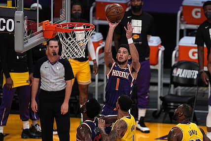 Jun 3, 2021; Los Angeles, California, USA; Phoenix Suns guard Devin Booker (1) shoots the ball in the first quarter against the Los Angeles Lakers during game six in the first round of the 2021 NBA Playoffs at Staples Center. Mandatory Credit: Kirby Lee-USA TODAY Sports