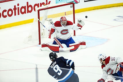 Jun 4, 2021; Winnipeg, Manitoba, CAN; Winnipeg Jets forward Andrew Copp (9) shoots wide of Montreal Canadiens goalie Carey Price (31) during the first period in game two of the second round of the 2021 Stanley Cup Playoffs at Bell MTS Place. Mandatory Credit: Terrence Lee-USA TODAY Sports