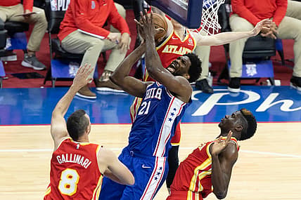 Jun 8, 2021; Philadelphia, Pennsylvania, USA; Philadelphia 76ers center Joel Embiid (21) drives for a shot against Atlanta Hawks center Clint Capela (15) and forward Danilo Gallinari (8) during the first quarter in game two of the second round of the 2021 NBA Playoffs at Wells Fargo Center. Mandatory Credit: Bill Streicher-USA TODAY Sports