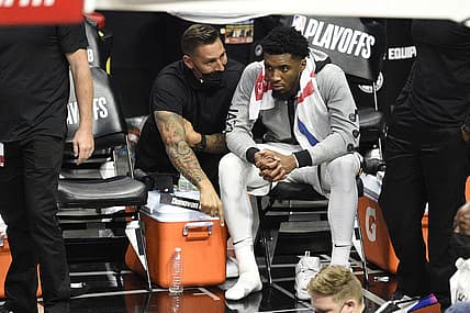 Jun 12, 2021; Los Angeles, California, USA; Utah Jazz guard Donovan Mitchell (45) sits on the bench with his shoe off against the LA Clippers in the fourth quarter during game three in the second round of the 2021 NBA Playoffs. at Staples Center. Mandatory Credit: Kelvin Kuo-USA TODAY Sports