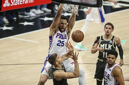 Jun 14, 2021; Atlanta, Georgia, USA; Philadelphia 76ers guard Ben Simmons (25) dunks over Atlanta Hawks guard Bogdan Bogdanovic (13) in the first quarter during game four in the second round of the 2021 NBA Playoffs at State Farm Arena. Mandatory Credit: Brett Davis-USA TODAY Sports